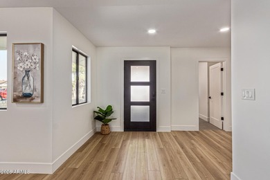 E X Q U I S I T E Golf Course Residence. Inside, you'll find a