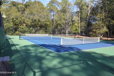 Located in the gated community, this vacant lot awaits your new - photo 7