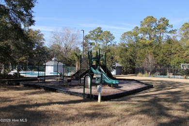 Located in the gated community, this vacant lot awaits your new - photo 8