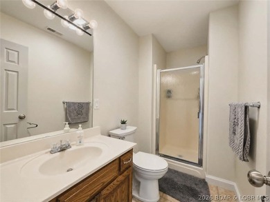 Step inside to vaulted ceilings and a stunning primary suite - photo 12