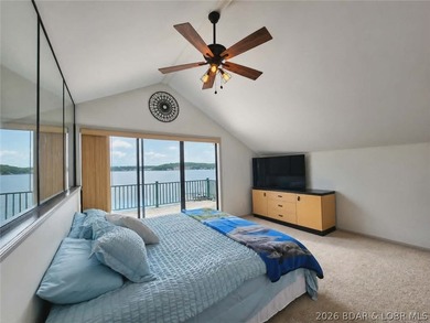 Step inside to vaulted ceilings and a stunning primary suite - photo 15