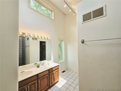 Step inside to vaulted ceilings and a stunning primary suite - photo 20
