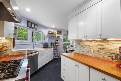 Set on a beautiful tree-lined street in Alden's Walk, this - photo 2