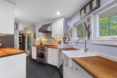 Set on a beautiful tree-lined street in Alden's Walk, this - photo 3