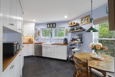 Set on a beautiful tree-lined street in Alden's Walk, this - photo 4