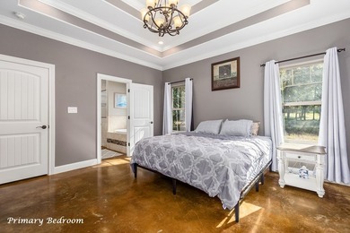 Experience peaceful waterfront living with this custom-built - photo 14