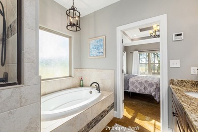 Experience peaceful waterfront living with this custom-built - photo 18