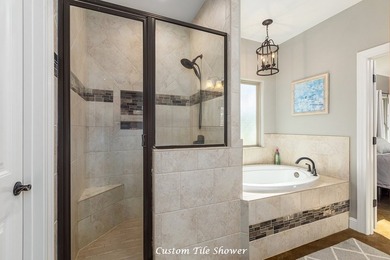 Experience peaceful waterfront living with this custom-built - photo 19