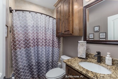 Experience peaceful waterfront living with this custom-built - photo 25