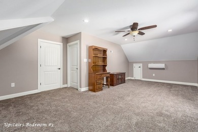 Experience peaceful waterfront living with this custom-built - photo 26
