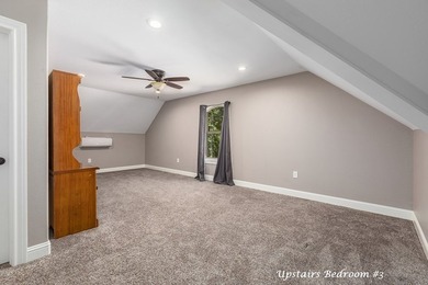 Experience peaceful waterfront living with this custom-built - photo 27