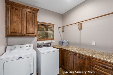 Experience peaceful waterfront living with this custom-built - photo 30