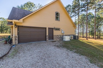 Experience peaceful waterfront living with this custom-built - photo 32
