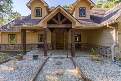 Experience peaceful waterfront living with this custom-built - photo 34