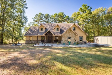 Experience peaceful waterfront living with this custom-built - photo 36