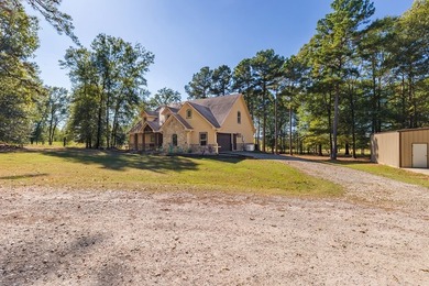 Experience peaceful waterfront living with this custom-built - photo 38