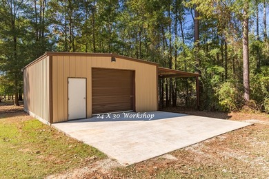 Experience peaceful waterfront living with this custom-built - photo 39