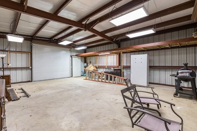 Experience peaceful waterfront living with this custom-built - photo 41