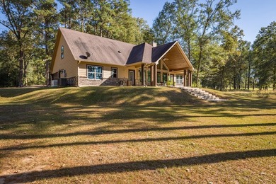 Experience peaceful waterfront living with this custom-built - photo 43