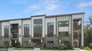 Welcome to this exceptional, nearly new condominium in the - photo 1