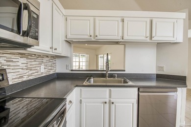 Manicured landscaping and soaring vaulted ceilings welcome you - photo 17