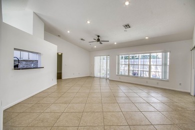 Manicured landscaping and soaring vaulted ceilings welcome you - photo 18
