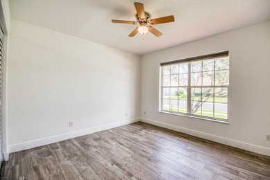Manicured landscaping and soaring vaulted ceilings welcome you - photo 21
