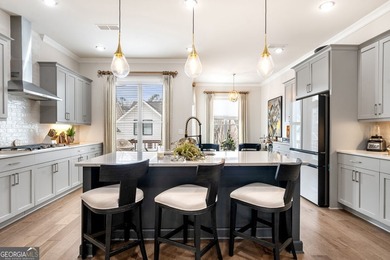 Welcome to this beautifully upgraded three-level townhouse