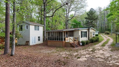 Check out this Lake Sinclair home overlooking peaceful water - photo 1