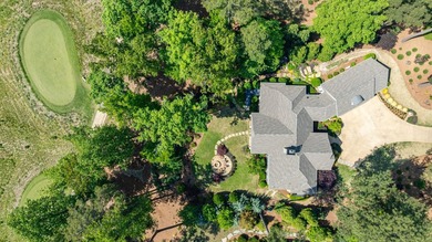 LIKE NEW CUSTOM HOME POSITIONED ALONG THE 11TH HOLE OF THE CREEK - photo 4