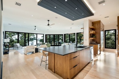 Experience a new level of lakeside living in the exclusive - photo 5