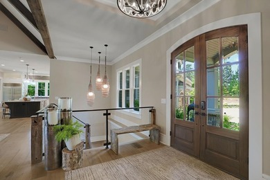 LIKE NEW CUSTOM HOME POSITIONED ALONG THE 11TH HOLE OF THE CREEK - photo 7