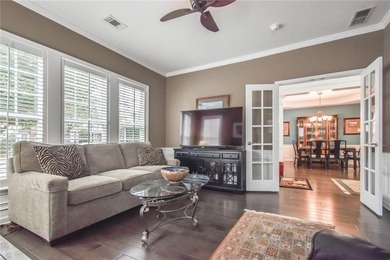 Welcome to this beautifully maintained four-bedroom, three-bath