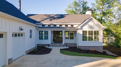 Lake living without compromise. This exceptional 2023-built home - photo 6