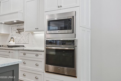 Nestled on a private wooded homesite in Hampton Hall, this - photo 29