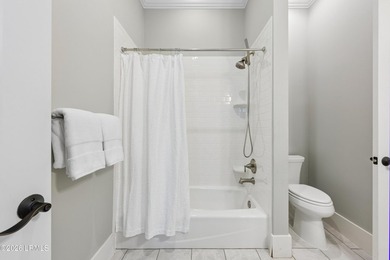 Nestled on a private wooded homesite in Hampton Hall, this - photo 45