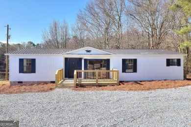 Lake Home For Sale in Canon, Georgia