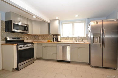 Welcome to 111 Fuller Ave in Islip! This charming, five-bedroom - photo 4
