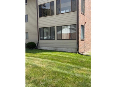 Main floor condo with enclosed patio on the north side of the - photo 2
