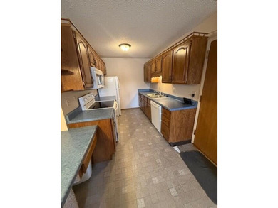 Main floor condo with enclosed patio on the north side of the - photo 7