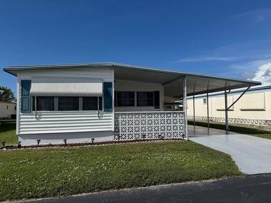 This 1971 home is offered turnkey and includes the golf cart! - photo 2