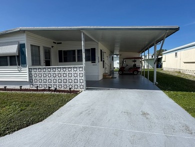 This 1971 home is offered turnkey and includes the golf cart! - photo 3
