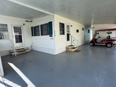This 1971 home is offered turnkey and includes the golf cart! - photo 4