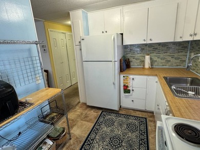 This 1971 home is offered turnkey and includes the golf cart! - photo 10