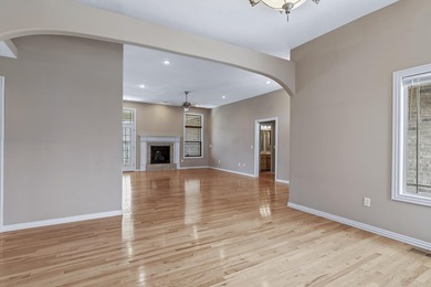 This beautiful all brick home featuring a 3 car garage and