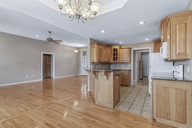 This beautiful all brick home featuring a 3 car garage and