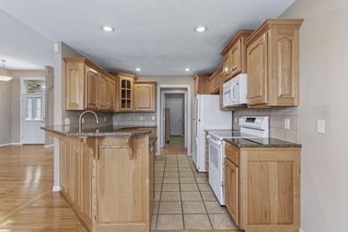 This beautiful all brick home featuring a 3 car garage and