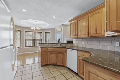 This beautiful all brick home featuring a 3 car garage and