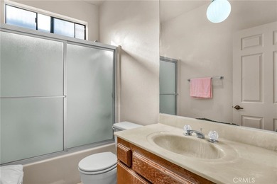 Welcome to this well-maintained top-floor unit located in the