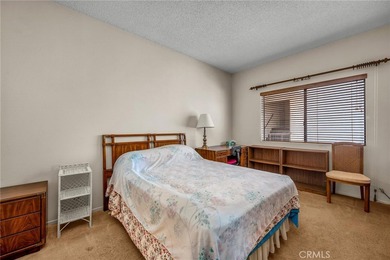 Welcome to this well-maintained top-floor unit located in the